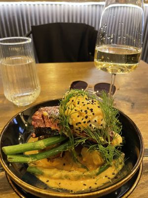Vegan salmon on top of potatoes and broccolini   at Meet Vegano in Malaga