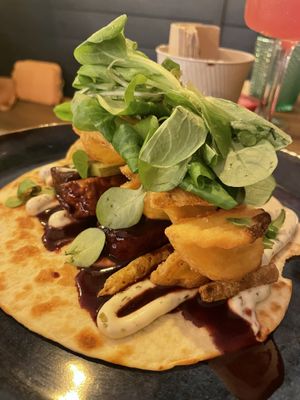 Tempeh bab with potato fries on tortilla  at Meet Vegano in Malaga