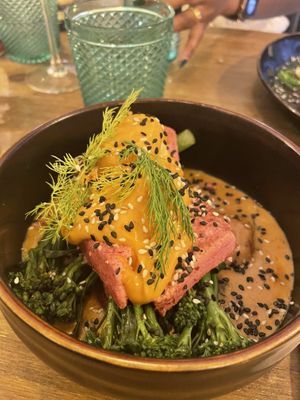 Salmon tofu on broccoli and potatoes in creamy sauce  at Meet Vegano in Malaga