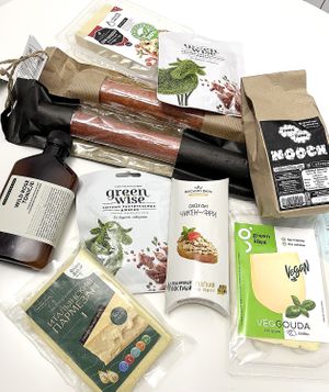 Vegan treasures delivered by Veganfood.am: sausages, cheeses (gouda, parmesan, one for pizza), "chicken" seitan, jerky, nooch, and rose tonic (vegan too). at Veganfood.am in Yerevan
