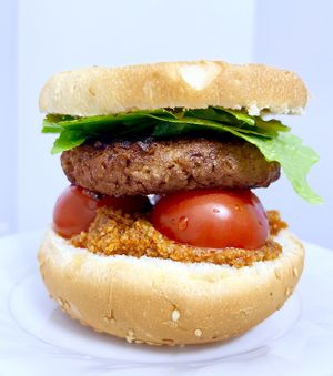 Homemade vegan burger made with vegan "Bite" cutlet that had been bought at Veganfood.am. The sauce on the bottom bun is muhammara. at Veganfood.am in Yerevan