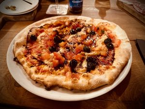 Pizza w/ vegan mozzarella, tomatoes & olives   at Kurhaus Bar in Lenzerheide