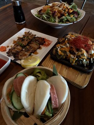 beet salad, chik’n skewers, roasted brussel sprouts and bao buns  at Tane Vegan Izakaya in Berkeley