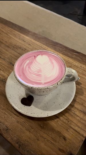 Beet latte (not worth it) + I asked to have it without sugar, explaining I don’t eat sugar, and still got a side chocolate with sugar 😅🙄  at Alchemy in Ubud