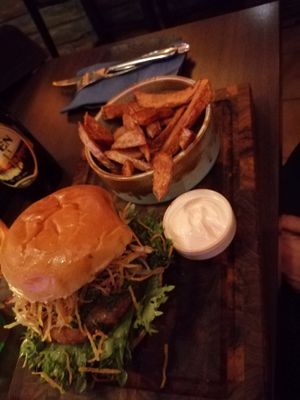 Vegan avocado burger with chips at Antu Kitchen in Stockholm