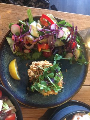 Spiced chickpea salad on charcoal bread with salad   at Susa Plant Based Kitchen in Ryde