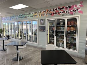 Awesome Jane Goodall quote and fridge/freezer items.  at Midtown Vegan Deli & Market in Tucson