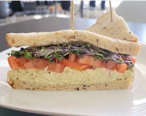 Egg Salad Sandwich! House made egg salad with tomatoes and Vista Microgreens on La Baguette 9 grain bread. at Midtown Vegan Deli & Market in Tucson