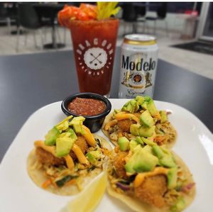 Taco Tuesday every Tuesday! Pictured here are BeLeaf Shrimp Culiche tacos with a vegan michelada.  at Midtown Vegan Deli & Market in Tucson