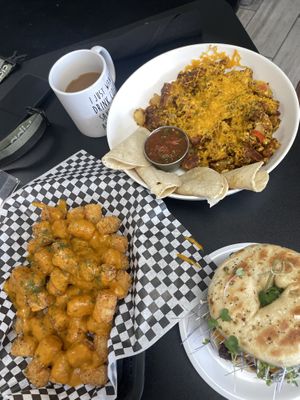 Death Free foodie sammy, scramble, and cheesy tots.  Soooooo good!  at Midtown Vegan Deli & Market in Tucson