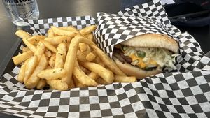 Monthly special Smashburger and golden crispy fries with alkaline water  at Midtown Vegan Deli & Market in Tucson
