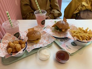 Tater tots, vegan shrimp sandwich, smash burger, skinny fries and watermelon lemonade   at Neat Burger - Canary Wharf in East London