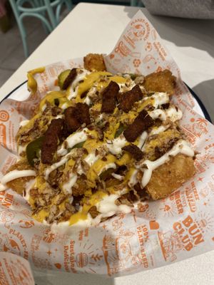 Loaded tater tots  at Neat Burger - Canary Wharf in East London