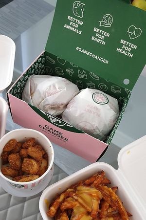 ‘Smash Daddy’ burgers, Neat nuggets, Skinny fries & Sweet potato fries with extra cheez at Neat Burger - Canary Wharf in East London