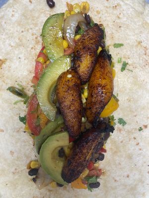 Inside a custom-made vegan burrito.  Don't want cheese?  No problem!  We can make you a wonderful custom meal with any of our vessels! at Salsa Street Grill in Madison