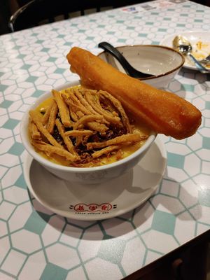 Pumpkin congee with vegan egg and youtiao at The Hainan Story 海南寶 -Jln Sultan in Central Singapore