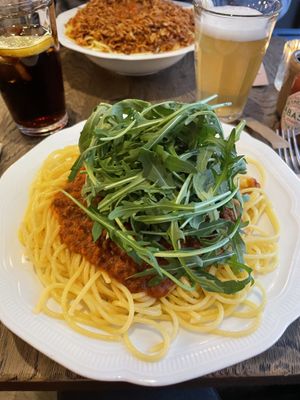 Smaller 'dog’ size spaghetti with rucola topping and tomato sauce with vegan ‘meat’ from ‘De Vegetarische Slager’  at Bavet in Kortrijk