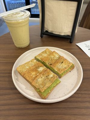 Pesto avocado toast and anti inflammatory smoothie   at Mana Café in Manama