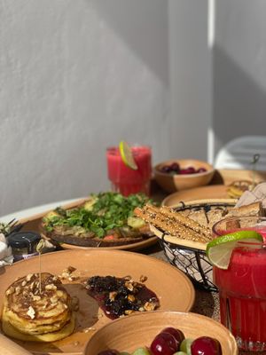 vegan Breakfast, watermelon juice, fruit salad, "bruschetta" and fluffy pancakes at Ethos Vegan Suites in Santorini