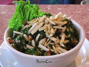 Chopped parsley with organic cracked wheat, diced tomatoes, cucumbers, fresh mint, lemon-olive oil dressing and raw almonds. at Baladi Mediterranean Cafe in Virginia Beach