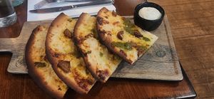 Pizza with pesto at The Volstead by Unity in Philadelphia