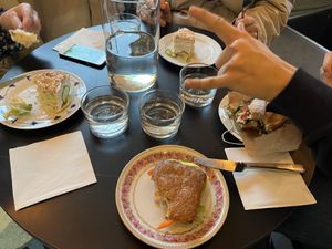 Smörgåstårta, BLT (right); small regular sandwich (close middle)  at Julie's Cafe in Gothenburg