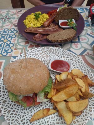 Ziba burger with avo and cheese and full English breakfast at Zibâ Life in Teulada