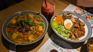 Vegan "ramen" (it's actually udon) and Vegan rice dish (with coconut "egg") and Up-Beet juice at Wagamama - 55th St in New York City