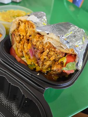 Vegan Buffalo Chickn Wrap with everything 🔥 at Palm Tree Caribbean Cafe in Hampton