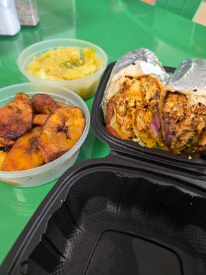 Vegan Buffalo Chickn Wrap with extra sides - cabbage and plantains 🤩 at Palm Tree Caribbean Cafe in Hampton