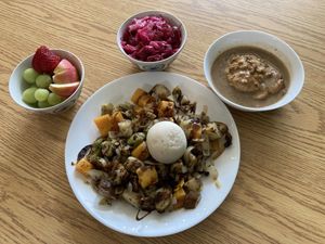 Garden hash with poached “egg”, fruit, beetkraut, biscuits and mushroom gravy   at The Fat Beet in Bellingham