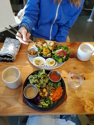 My marinated tofu bibimbap and my omnivore friend's bento. We both got the hot cardamom chai. Delicious on a freezing day! at Made in House in Seattle