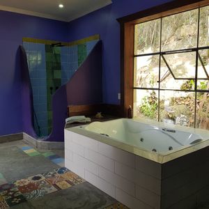 The huge bath of the penthouse offers a two persons hot tub with a view and a huge shower. Perfect for honeymoon stay-overs at Soulrebel Rio in Rio De Janeiro