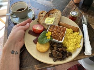 Full Venglish (£12 sausage, bacon, scrambled tofu, tomato, mushroom, hash brown, baked beans and toast) + black coffee (£3)  at Cafe@62 in Brighton