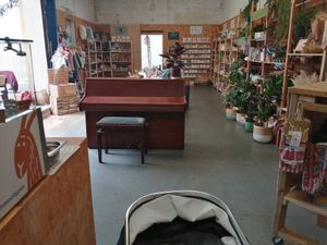 Indoor seating plus shop shelves selling plants, eco make up, stationery, second hand clothes, gifts etc at Two Old Goats  in Market Harborough