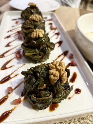 Sorrel salad with pomegranates, walnuts, fried onion, garlic and spices. On the menu. at Anoush in Yerevan