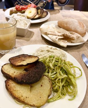 Baked potatoes, raw zucchini salad, mutabal. Order in advance. at Anoush in Yerevan