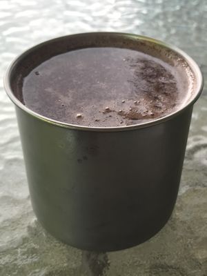 Cup of grape juice came with menu of day    at Tulia in Medellin