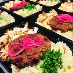 Dinner to go, veggie burger with olive oil crushed red potatoes and roasted cauliflower and onion gravy   at Jules' Kitchen in Ipswich