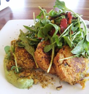 Sweet potato, coconut and lupin fritters with avocado puree and salad at Source Foods in Perth