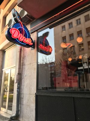 The neon sign outside at Intergalactic Diner in Belgrade