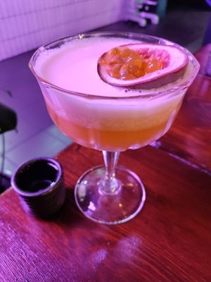 Passion fruit cocktail and shot of sake. Come 5-6pm for 2 for 1 special! at Bonsai Plant Kitchen in Brighton