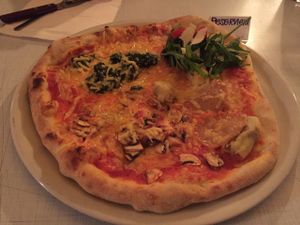 Pizza topped with spinach, mushrooms, and fake ham. The Parmesan on the arugula salad was incredible.
 at Sfizy Veg in Berlin