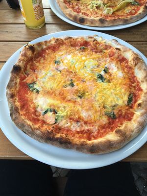 Vegan three-cheese pizza with basil. at Sfizy Veg in Berlin