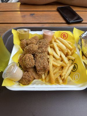 nuggets, tenders with mustard, spicy sauce and smokey sauce   at La ReContra in Lima