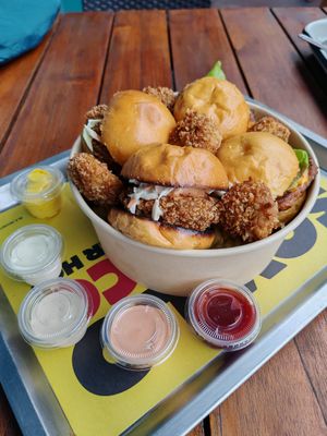 Four mini burgers (the crispy and bacon and cheese) at La ReContra in Lima