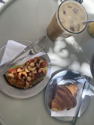Avocado toast, croissant & iced coffee with cashew milk   at Barro Café in Buenos Aires