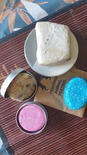 Blue: balsam, pink: shampoo, beige with orange stripes: shampoo, soap on plate: handsoap at LUSH - Westfield Mall of Scandinavia in Solna