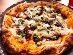 Pumpkin Pizza with avocado pesto and caramelized onions at Pianta in Bogota