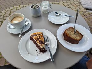 Vegan snickerscake and banana bread with cappuccino with soy 'milk'. at Café Mia in Lemgo